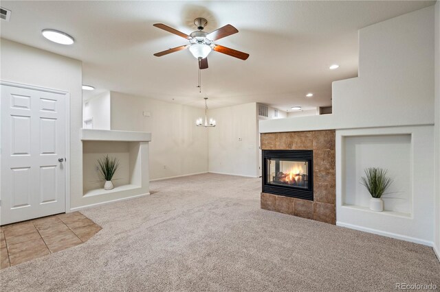 9907 Martin Luther King Blvd Unit 103, Denver, CO 80238 - unfurnished living room with carpet flooring, ceiling fan, a tiled fireplace, a chandelier, and recessed lighting