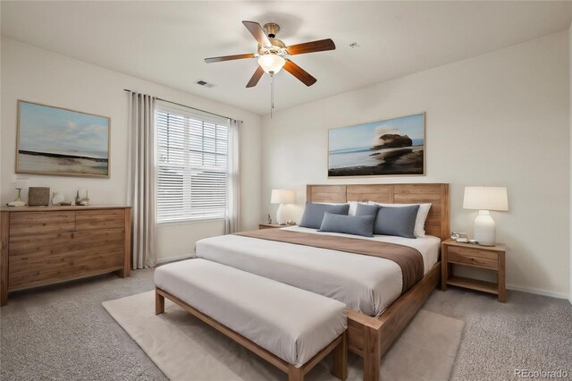 9907 Martin Luther King Blvd Unit 103, Denver, CO 80238 - bedroom featuring light colored carpet, baseboards, and ceiling fan