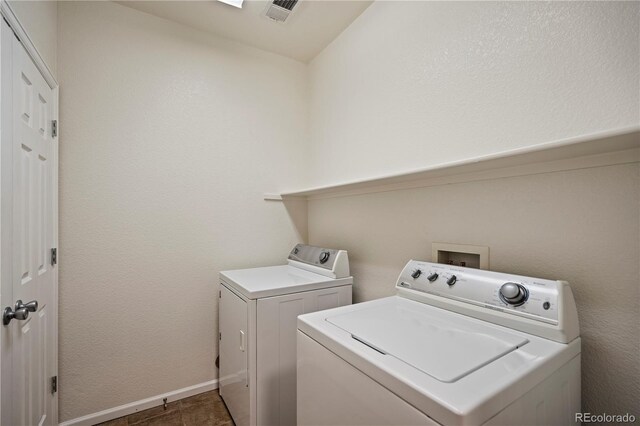9907 Martin Luther King Blvd Unit 103, Denver, CO 80238 - laundry room with washing machine and clothes dryer and baseboards