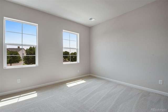 unfurnished room featuring carpet floors