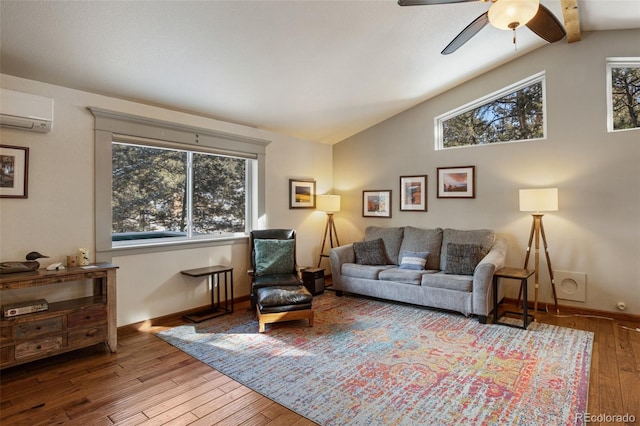 living room featuring lofted ceiling, a wall mounted air conditioner, light hardwood / wood-style floors, and ceiling fan