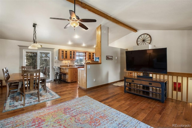 living room with vaulted ceiling with beams, dark wood-type flooring, and ceiling fan