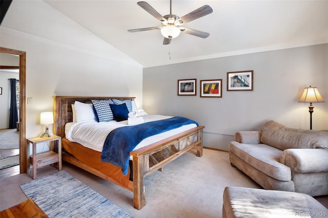 bedroom featuring lofted ceiling, light carpet, ornamental molding, and ceiling fan