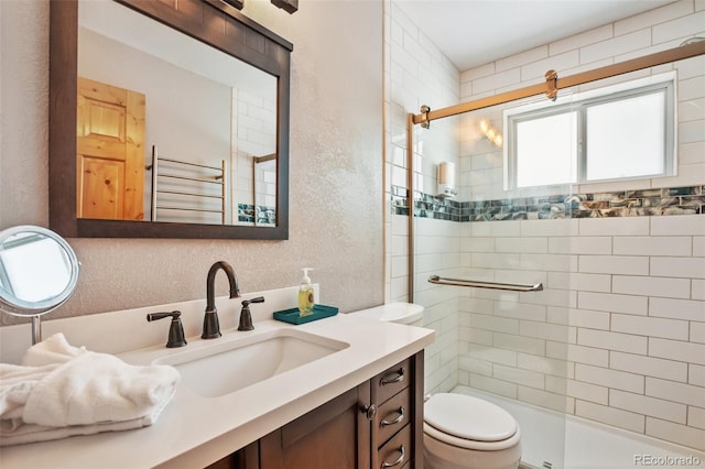 bathroom featuring radiator heating unit, toilet, a shower with door, and vanity