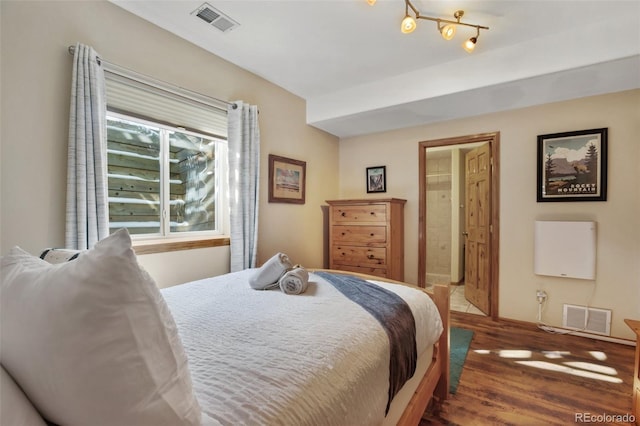 bedroom featuring dark wood-type flooring