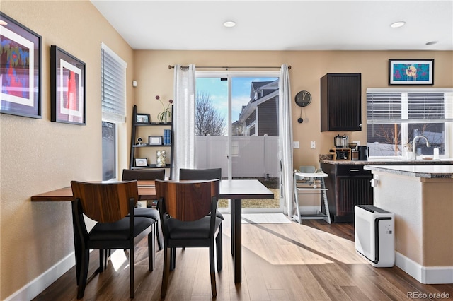 dining space featuring recessed lighting, baseboards, and dark wood-type flooring