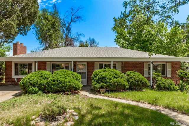 1000 Salem St, Aurora, CO 80011 - single story home featuring a chimney, brick siding, and a front yard