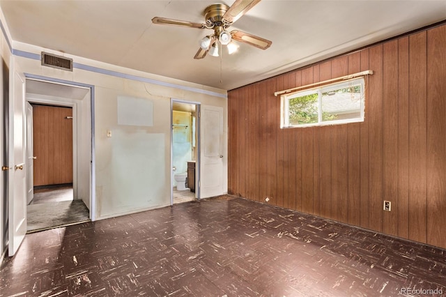 1000 Salem St, Aurora, CO 80011 - spare room with wooden walls and a ceiling fan