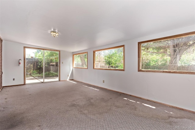 1000 Salem St, Aurora, CO 80011 - unfurnished room featuring healthy amount of natural light, baseboards, and carpet floors