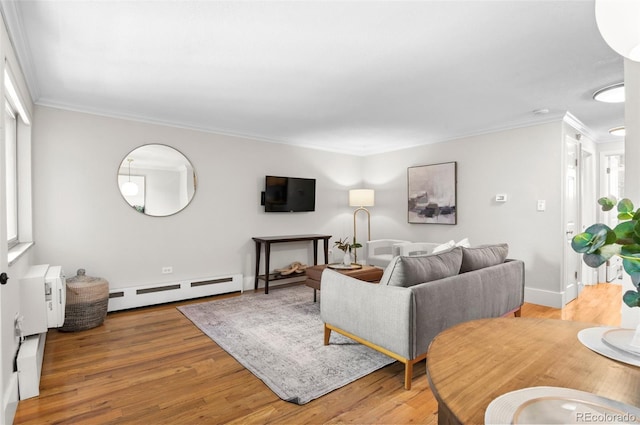 558 N Washington St Unit 305, Denver, CO 80203 - living area with a baseboard radiator, wood finished floors, crown molding, and healthy amount of natural light