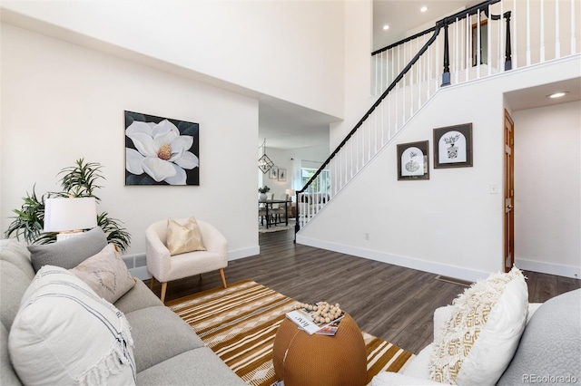 9610 S Dover Way, Littleton, CO 80127 - living area with stairway, dark wood-style flooring, a high ceiling, and recessed lighting