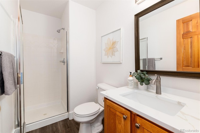 9610 S Dover Way, Littleton, CO 80127 - bathroom featuring a stall shower, vanity, and wood finished floors