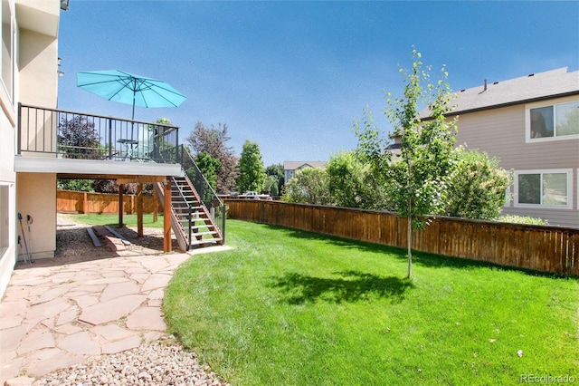 9610 S Dover Way, Littleton, CO 80127 - fenced backyard featuring stairway and a patio area