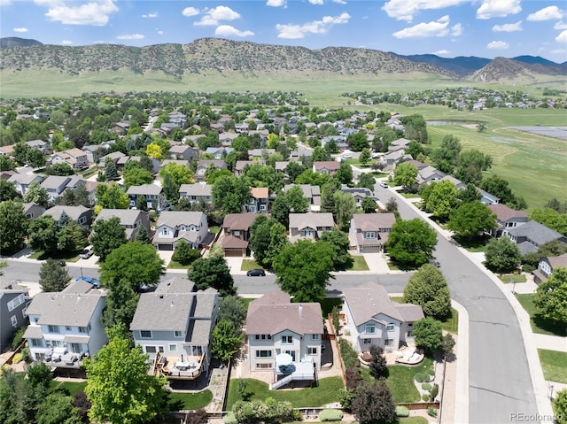 9610 S Dover Way, Littleton, CO 80127 - aerial perspective of suburban area with a mountainous background and a golf course