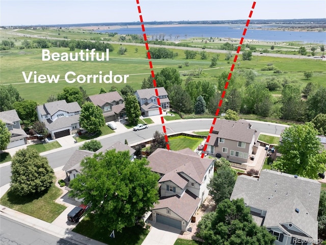 9610 S Dover Way, Littleton, CO 80127 - aerial perspective of suburban area with a nearby body of water and property parcel outlined