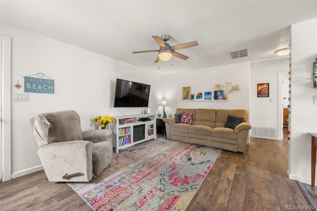 living room with ceiling fan and hardwood / wood-style floors