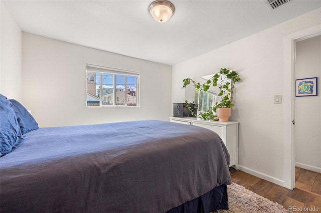 bedroom featuring dark hardwood / wood-style floors