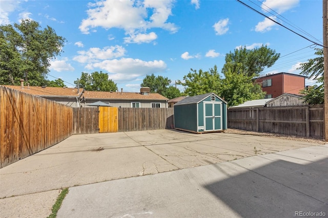 exterior space with a storage unit and a patio area