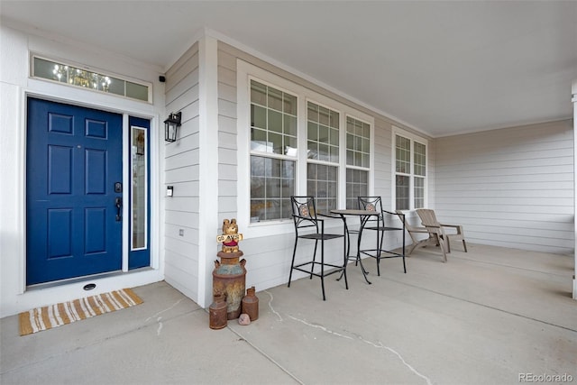 doorway to property featuring covered porch