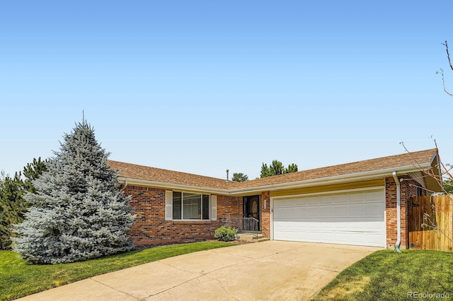 6212 S Ash Cir W, Centennial, CO 80121 - single story home featuring brick siding, a garage, and driveway