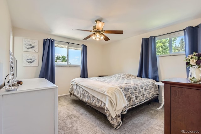 6212 S Ash Cir W, Centennial, CO 80121 - bedroom with multiple windows, light colored carpet, and ceiling fan