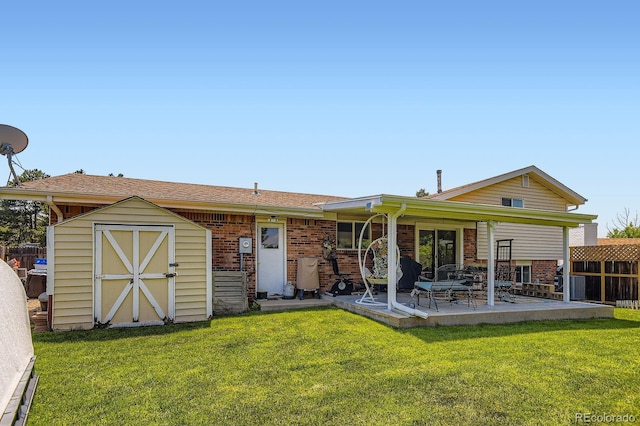 6212 S Ash Cir W, Centennial, CO 80121 - rear view of house with a storage unit, a patio, and brick siding