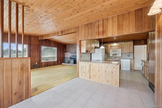 150 Apache Trl, Woodland Park, CO 80863 - kitchen featuring white appliances, open floor plan, wood walls, light tile patterned flooring, and wooden ceiling