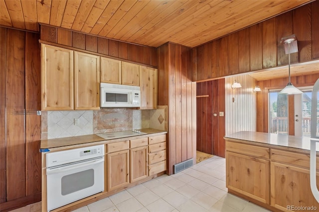 150 Apache Trl, Woodland Park, CO 80863 - kitchen with white appliances, wooden ceiling, tasteful backsplash, wood walls, and light brown cabinets