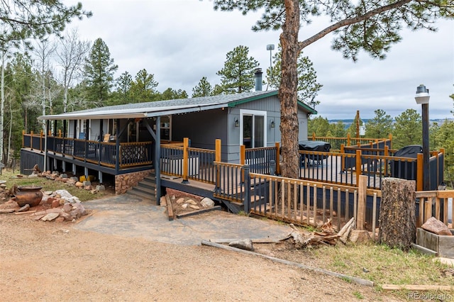 view of front of property featuring a wooden deck