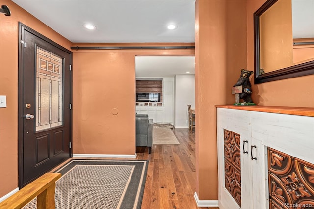 foyer with light hardwood / wood-style flooring