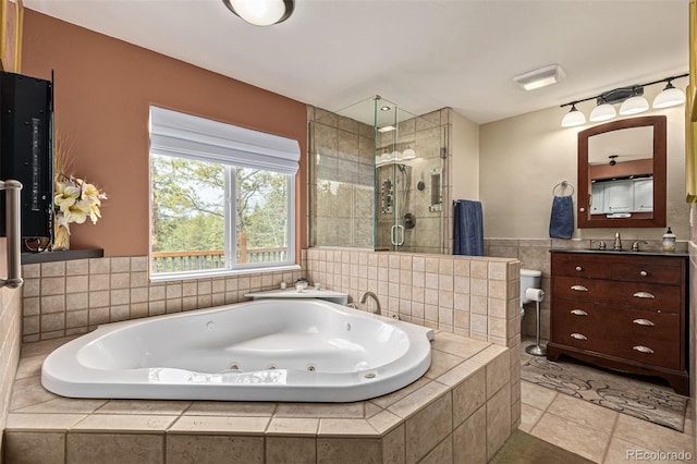 bathroom featuring vanity, tile floors, and plus walk in shower