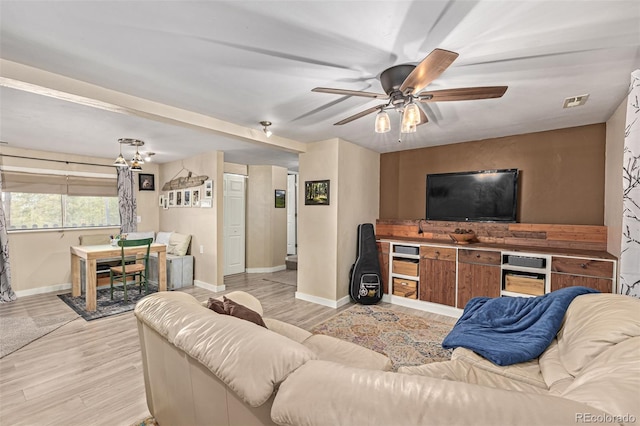 living room with light hardwood / wood-style floors and ceiling fan