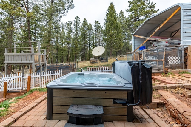 view of patio / terrace with a hot tub