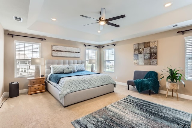 2165 Summerlin Ln, Longmont, CO 80503 - bedroom with light colored carpet, a raised ceiling, baseboards, recessed lighting, and ceiling fan