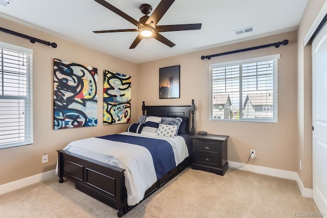 2165 Summerlin Ln, Longmont, CO 80503 - bedroom featuring baseboards, multiple windows, light colored carpet, and a ceiling fan