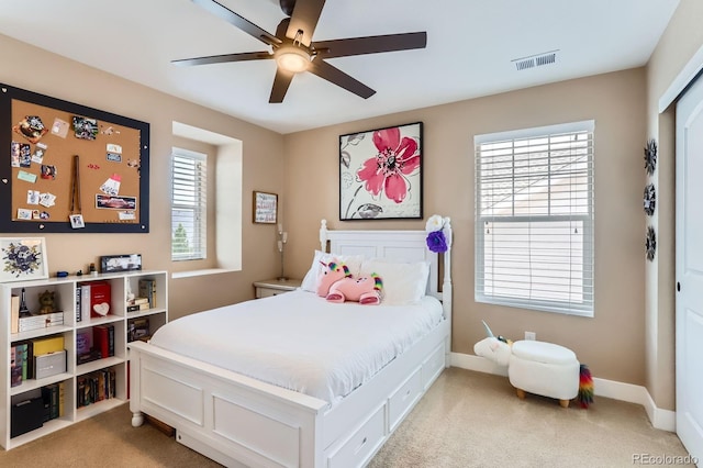 2165 Summerlin Ln, Longmont, CO 80503 - bedroom featuring light carpet, baseboards, and a ceiling fan