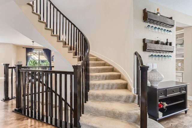 2165 Summerlin Ln, Longmont, CO 80503 - stairway featuring baseboards and wood finished floors