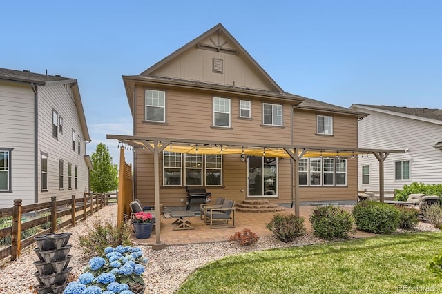 2165 Summerlin Ln, Longmont, CO 80503 - back of property featuring board and batten siding, a patio, and entry steps