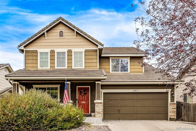 10076 Helena St, Commerce City, CO 80022 - view of front of home with concrete driveway, a tile roof, and an attached garage