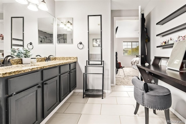 10076 Helena St, Commerce City, CO 80022 - ensuite bathroom with vanity, tile patterned flooring, and a chandelier