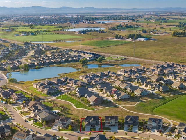 bird's eye view featuring a water and mountain view