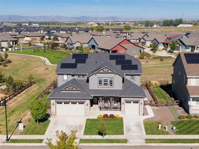 birds eye view of property featuring a mountain view