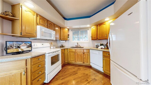 2266 S Kenton St, Aurora, CO 80014 - kitchen featuring light wood finished floors, open shelves, backsplash, a sink, and white appliances