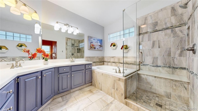 2266 S Kenton St, Aurora, CO 80014 - full bath featuring a sink, a shower stall, double vanity, and a bath