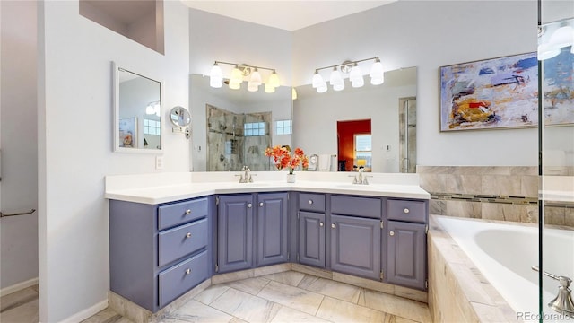 2266 S Kenton St, Aurora, CO 80014 - full bathroom with a garden tub, a sink, a shower stall, and double vanity