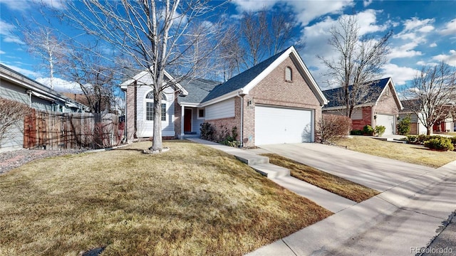 2266 S Kenton St, Aurora, CO 80014 - ranch-style house featuring brick siding, concrete driveway, a front yard, fence, and a garage