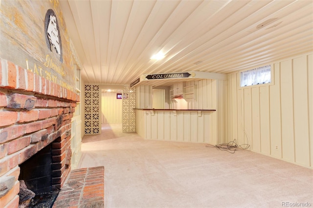 interior space featuring carpet flooring and a fireplace