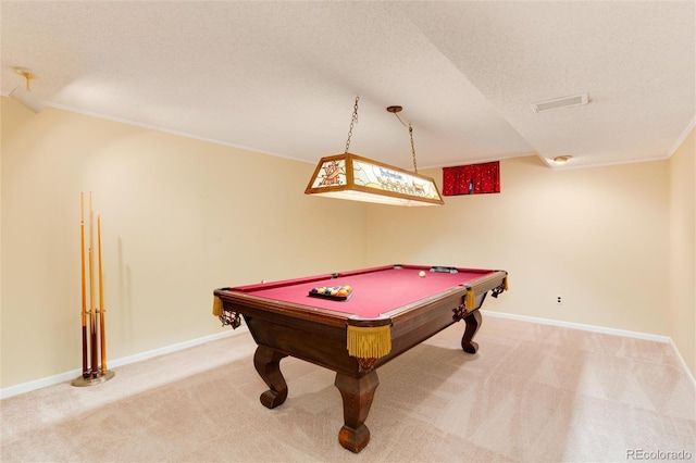 playroom with pool table, ornamental molding, light colored carpet, and a textured ceiling