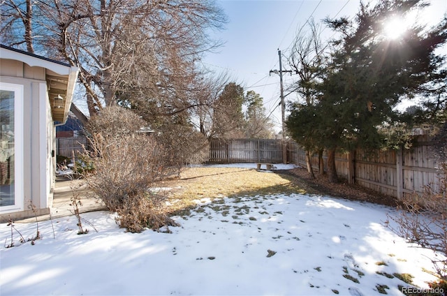 view of yard covered in snow