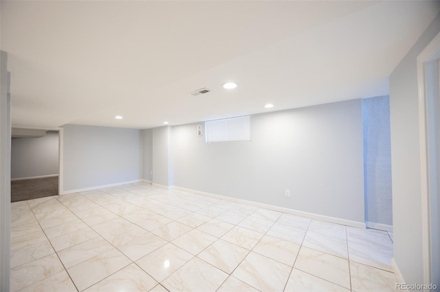 finished below grade area featuring recessed lighting, visible vents, and baseboards